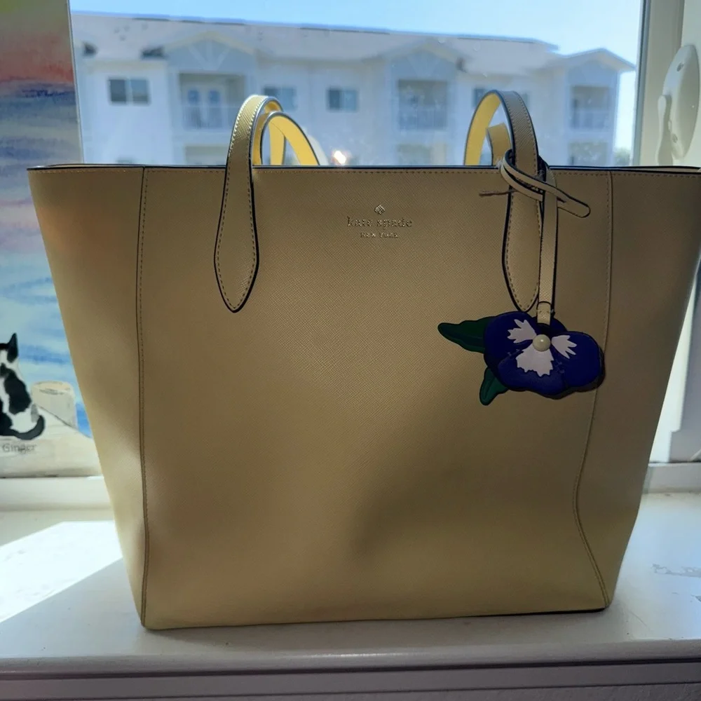 Kate Spade New York Light Yellow Dana Tote with Purple Floral Pansy Charm